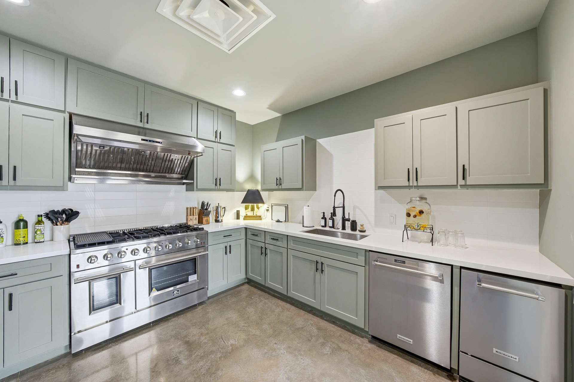 Chef-ready prep kitchen with custom cabinetry and range